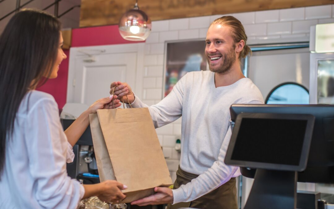 Client récupérant une commande Click & Collect dans une boulangerie avec 6XPos